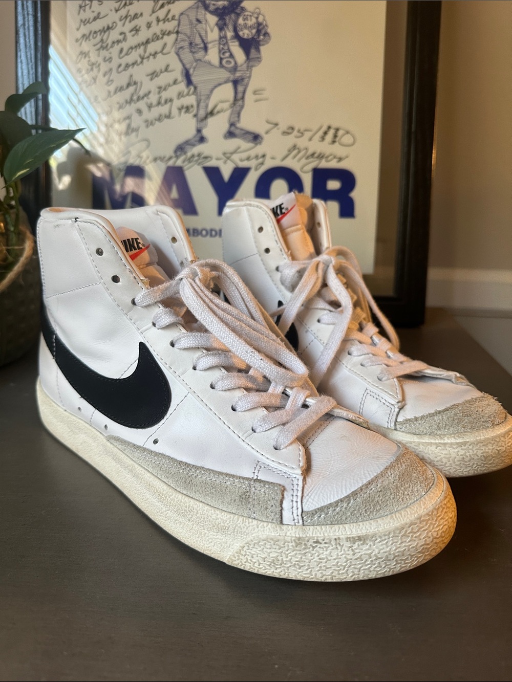 Nike White High-Top Sneakers with Black Swoosh